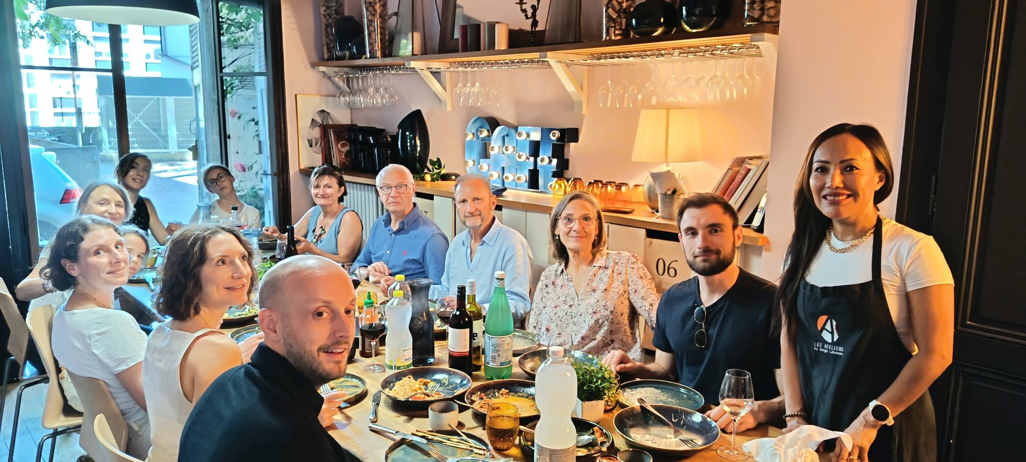 Guests dining at the Geneva atelier
